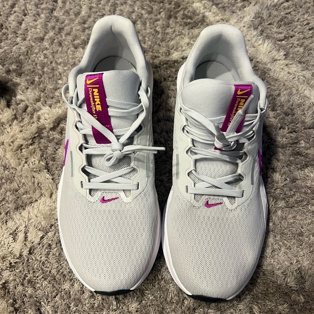 New in box size 9 Nike running shoes. See pics for details